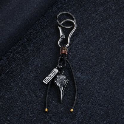 Retro leather rope keychain with lobster buckle and skull pendant in bronze and silver
