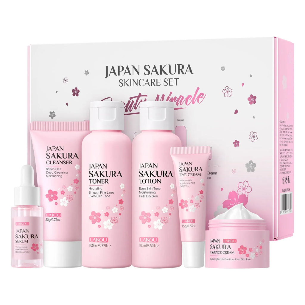 Boxed Cherry Blossom 6-piece skincare set showing cleanser, toner, creams, and serum.