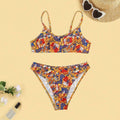 Plus size women's floral print bikini swimsuit with strap design on white background