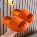 Children's colourful EVA slippers with a non-slip sole, shown in blue, green, orange, pink, and yellow.