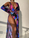 Women's three-piece polyester swimsuit set with matching coat in one of four available colour patterns.