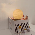 Maglev moon and planet night light with floating models, three astronaut figurines, and LED glow