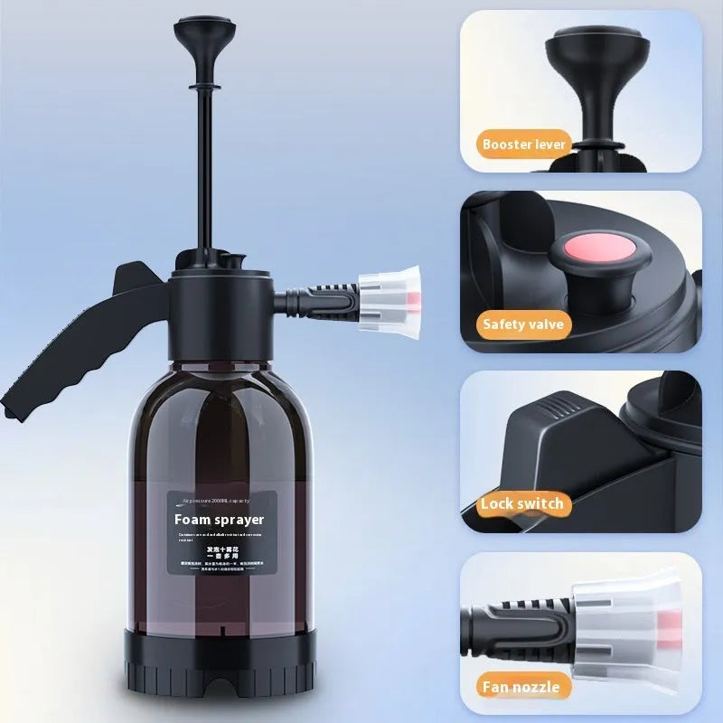 Black 2L hand-held foam watering can sprayer with ergonomic handle and pump mechanism.