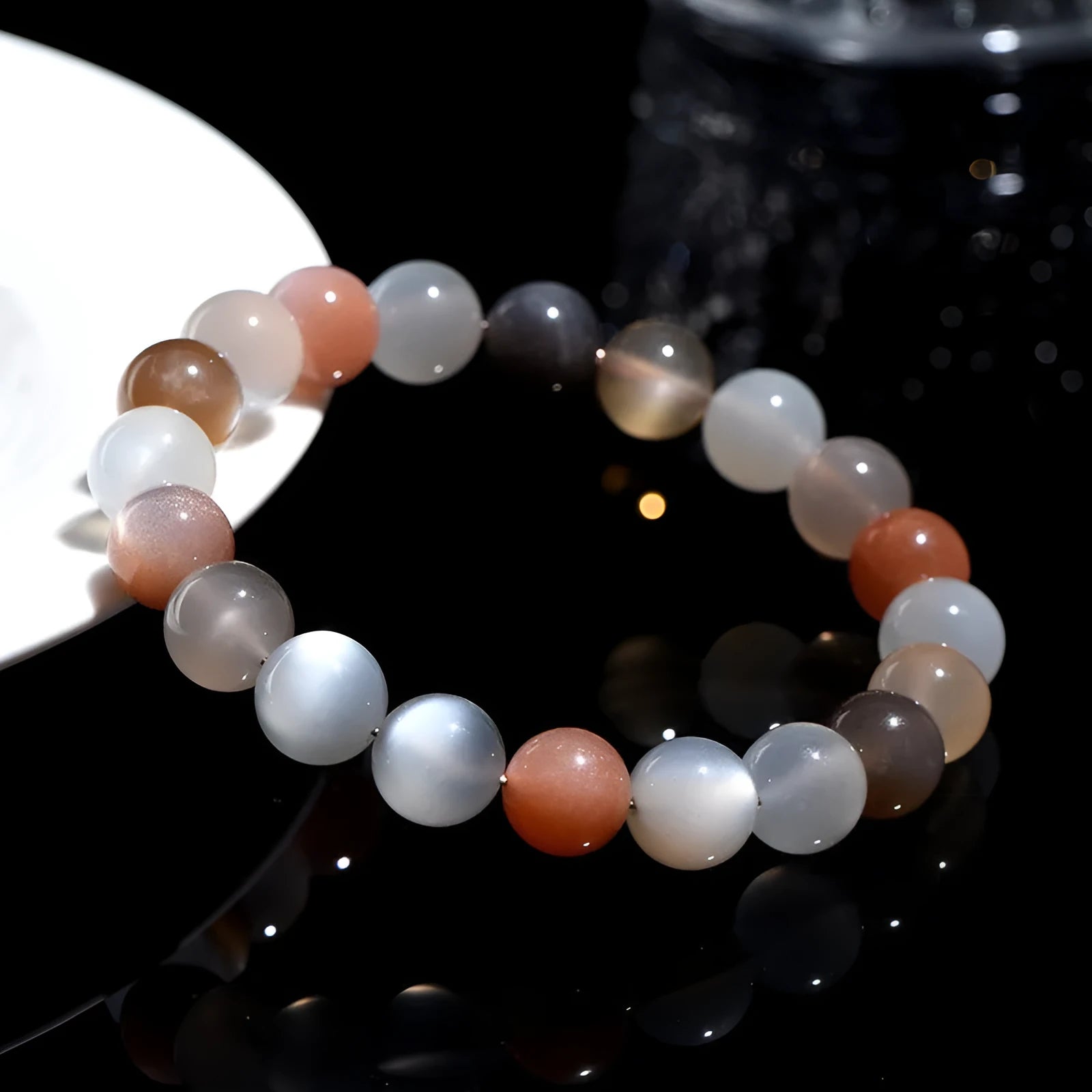 Natural colourful moonlight moonstone duobao bracelet with 8mm beads on a wrist.