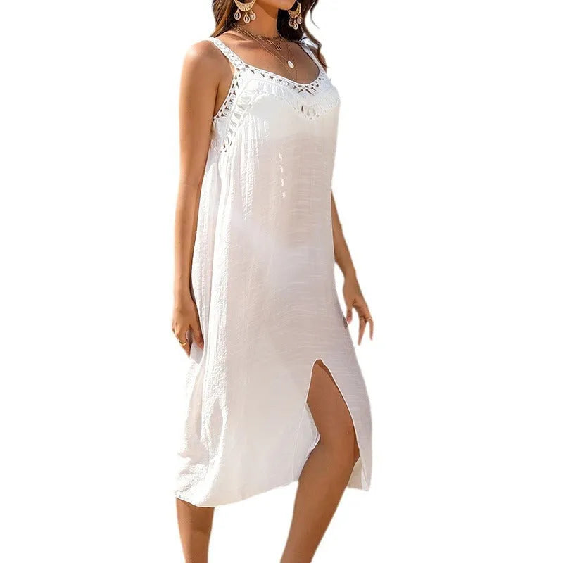 White women's beach dress with adjustable suspenders and hollow crochet weave construction