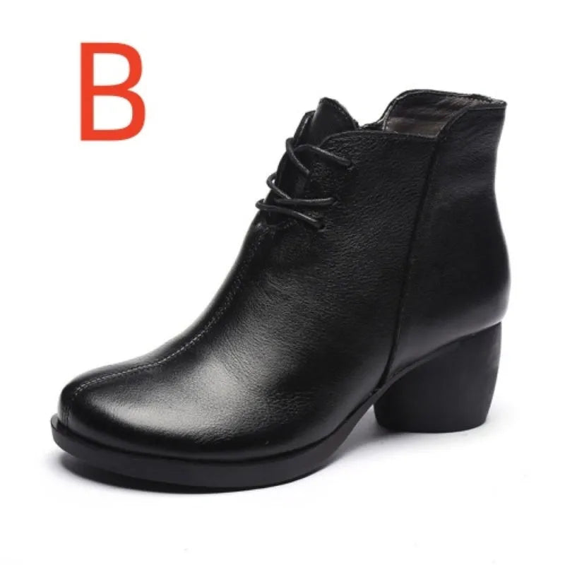 Brown leather women's Martin boots with a thick heel and round toe on a white background.