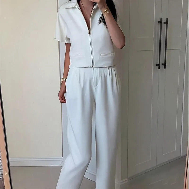 Damascus loose-fit short sleeve polyester top on a hanger in black, white, and yellow colour options.