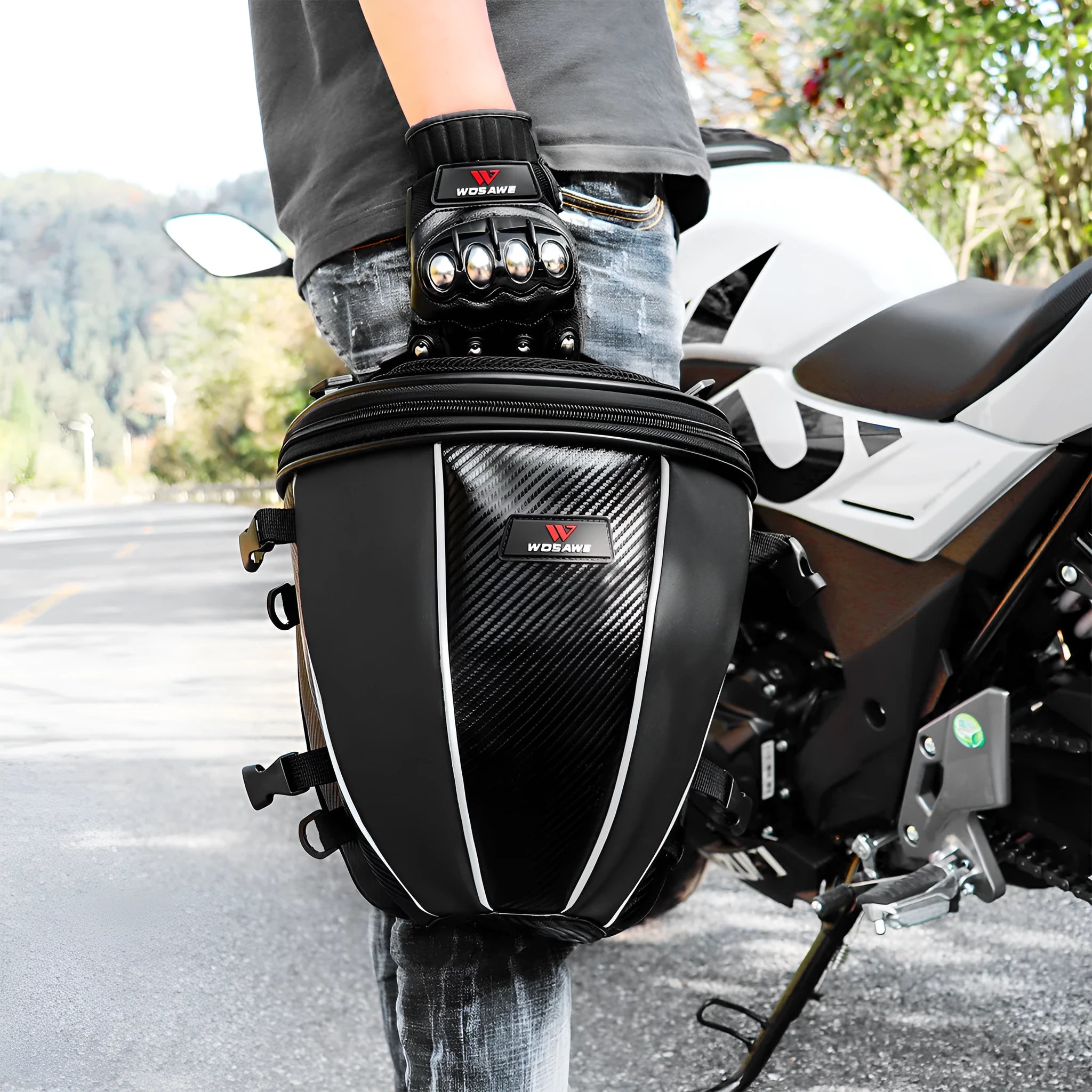 Black motorcycle seat bag with reflective strip, showing convertible crossbody strap and internal pocket organisation