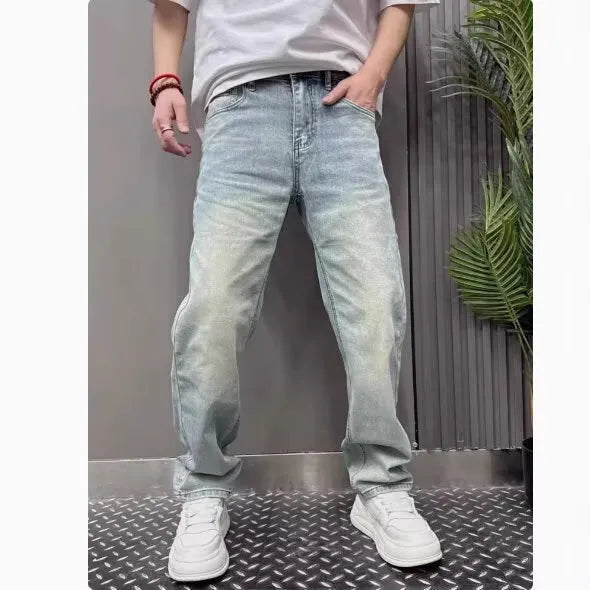 Light blue straight slim denim trousers for teenagers with mid-rise waist and zipper fly closure