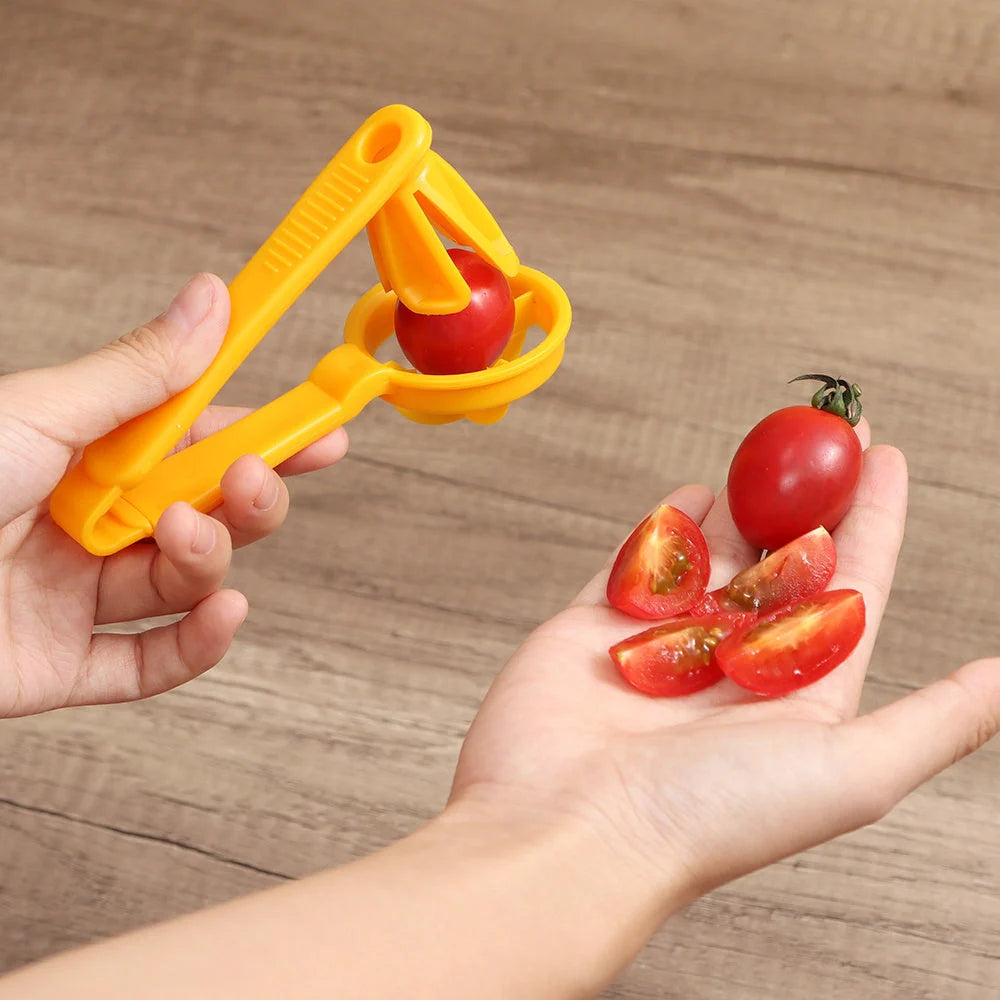 Manual tomato slicer with serrated knife for even dicing, available in red and yellow