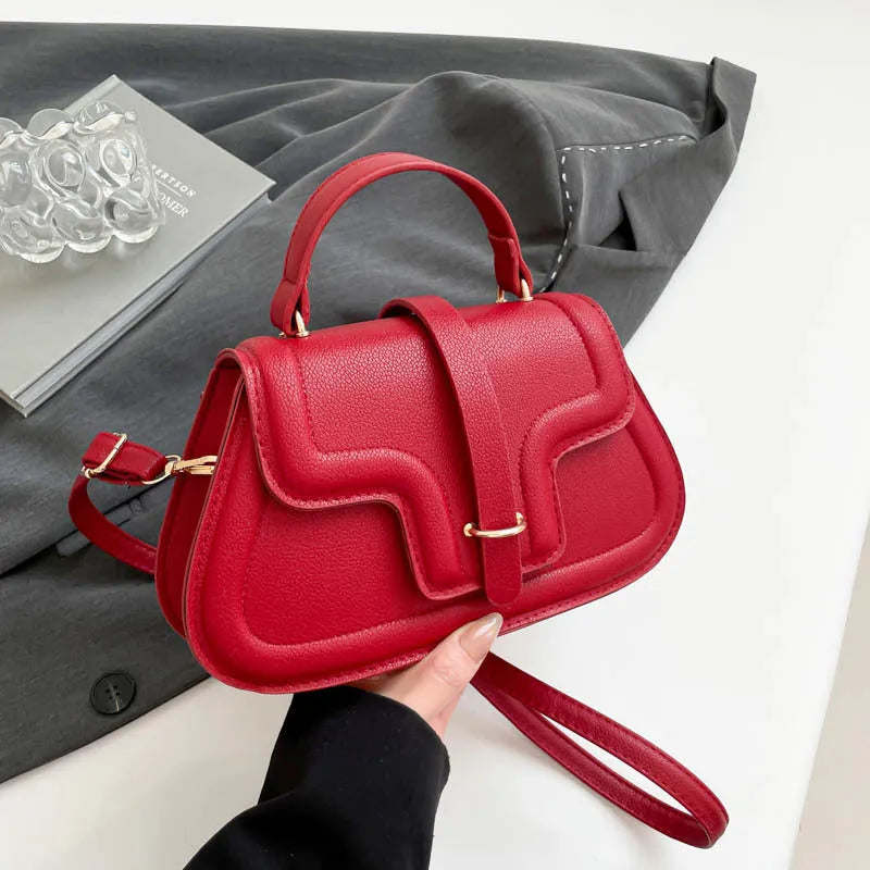 Urban Simplicity PU shoulder bag in horizontal square shape with sewing thread detail, available in black colour