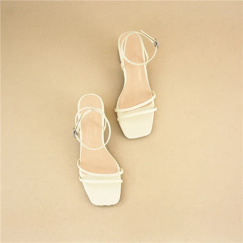 Beige women's stiletto sandals with a chunky block heel and an adjustable ankle buckle strap.