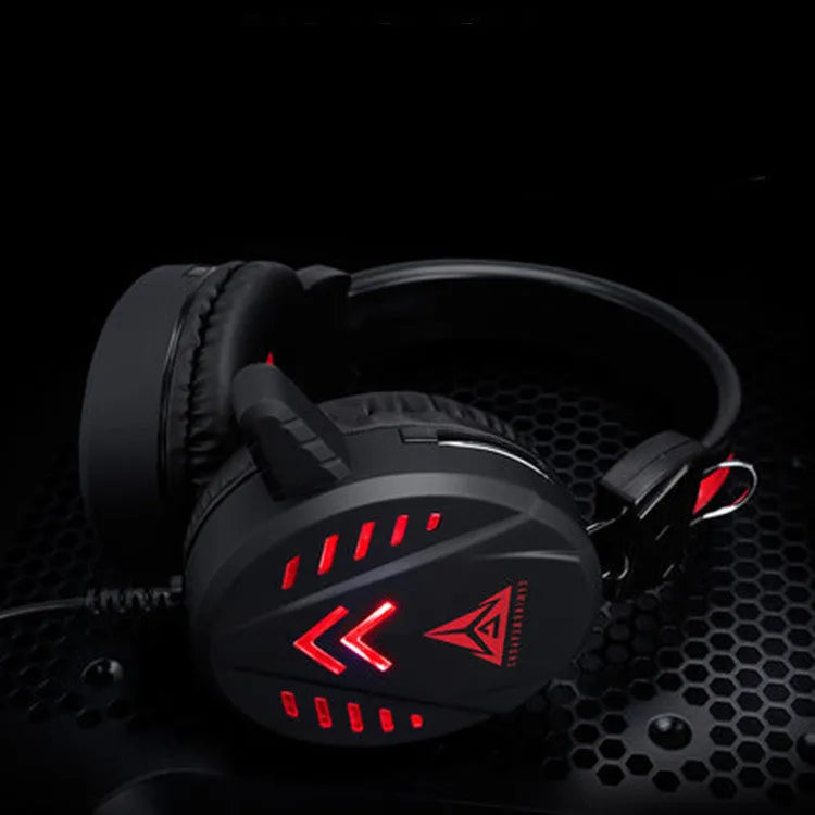 Black wired gaming headset with microphone and luminous glow for PC computer gaming