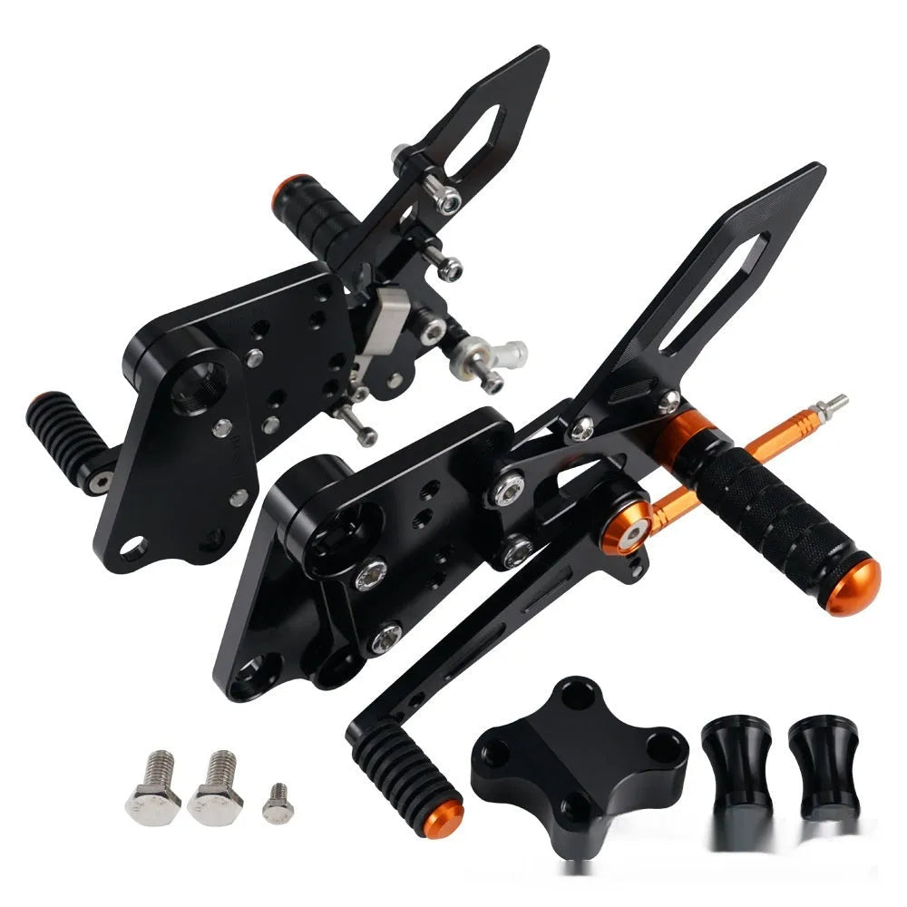 KTM DUKE motorcycle raised footrest relocation kit in black and orange colours