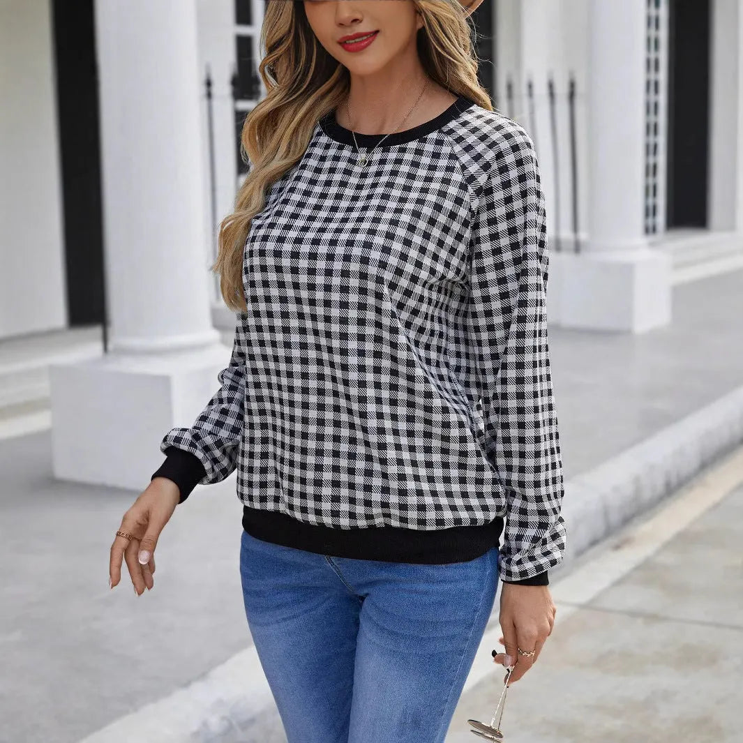 Black long sleeve pullover sweater with a printed plaid stripe pattern on a mannequin.