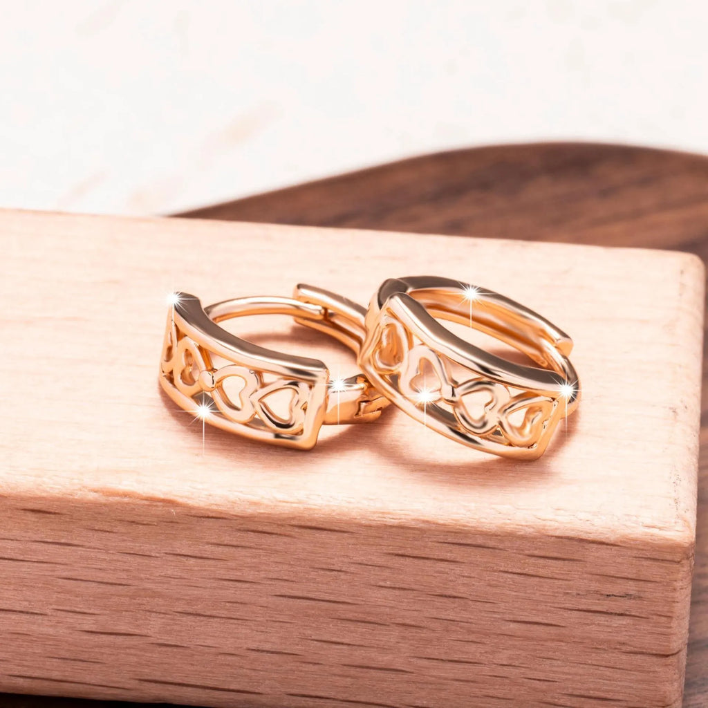 Love Glossy Hollow Ear Clip in rose gold copper electroplated earrings on display