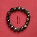 Hand-woven unisex bracelet with round 10mm golden obsidian beads in a vintage style.