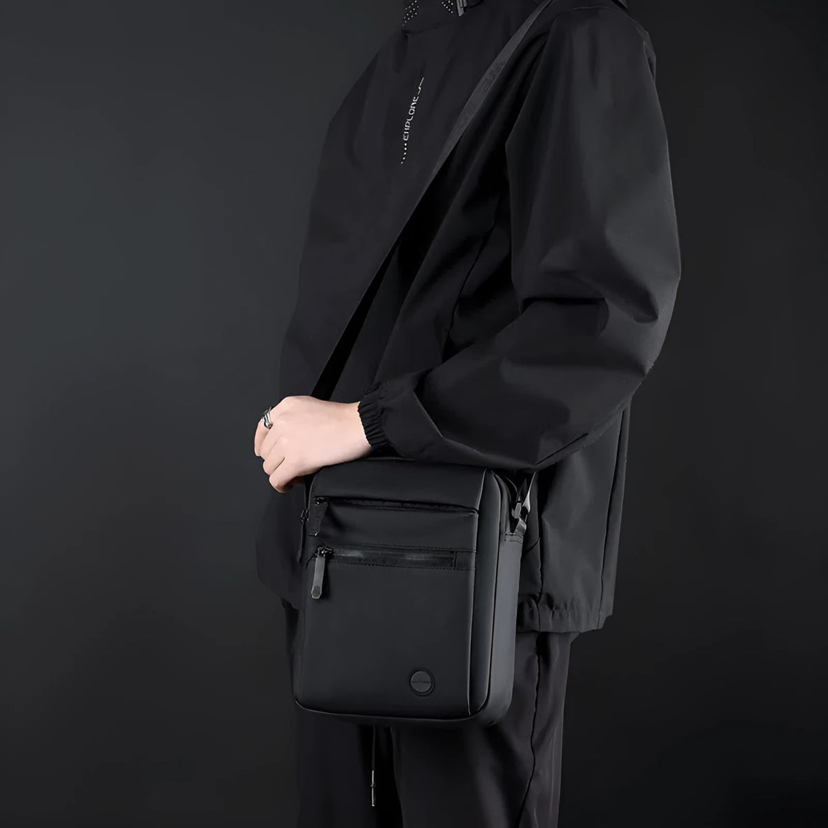 Men's water-repellent PU crossbody bag in army green with single-shoulder strap on grey background