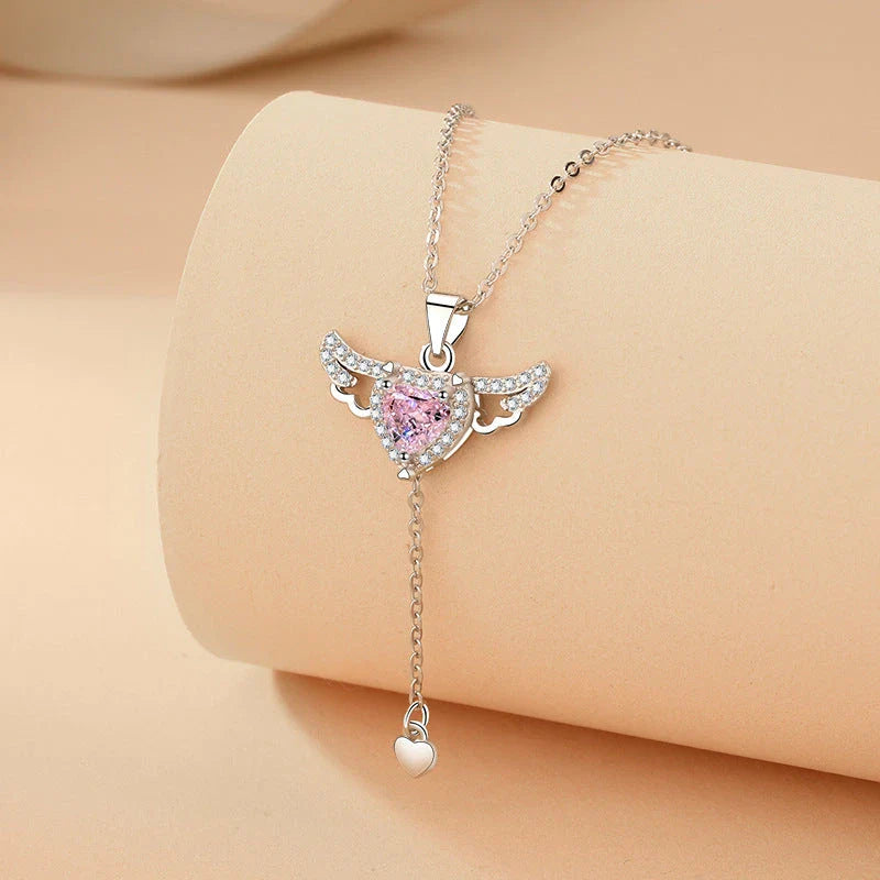 Sparkling Cupid heart necklace with fluttering angel wings, made of titanium steel and zircon crystals