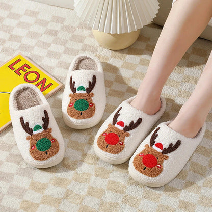 Cozy festive elk-themed slippers in red and green colors, featuring plush, soft materials for comfortable indoor wear