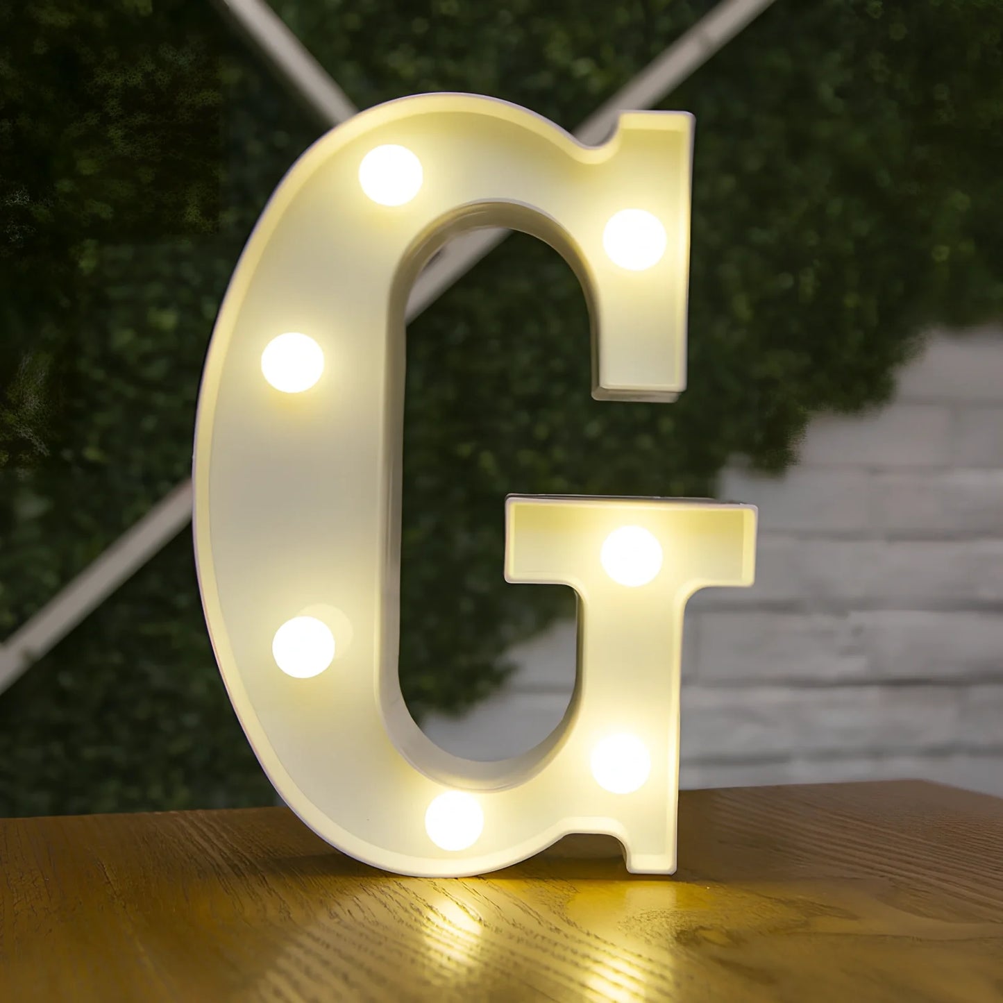 White plastic LED alphabet marquee sign with warm white illumination, 22cm height with battery operation