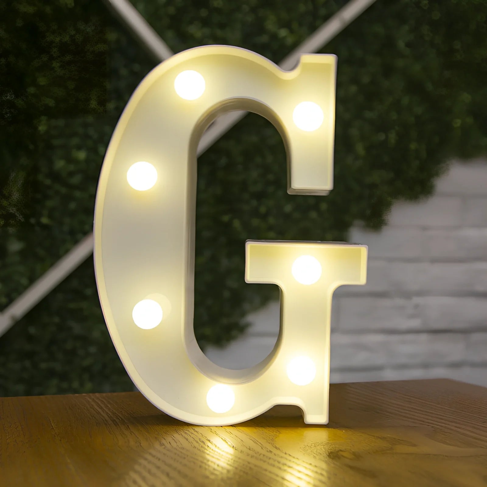 White plastic LED alphabet marquee sign with warm white illumination, 22cm height with battery operation