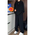 Men's black slim fit long sleeve polo shirt and matching trousers casual two-piece set.