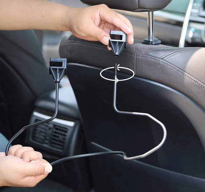 Black metal snap-on hat bracket mounted on a car rearview mirror