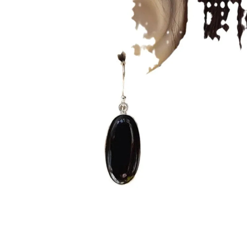 Women's geometric earrings with black agate oval pendants and silver electroplated finish