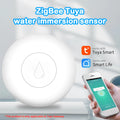 Compact white Zigbee wireless water flood sensor on a surface