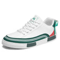 Men's beige and white with green casual canvas shoes showing mesh panel sections on sides.