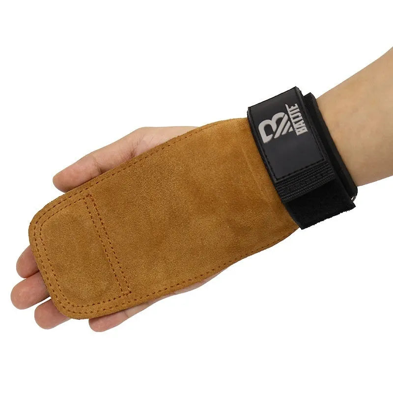 Brown leather wrist protector with adjustable strap for pull-up and fitness training.