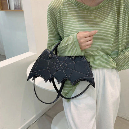 A stylish PU leather shoulder bag with a unique spider web and Batgirl-inspired design, available in a variety of vibrant colors.