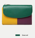 Women's short wallet with soft leather texture and stitching detail in solid colour, urban minimalist style