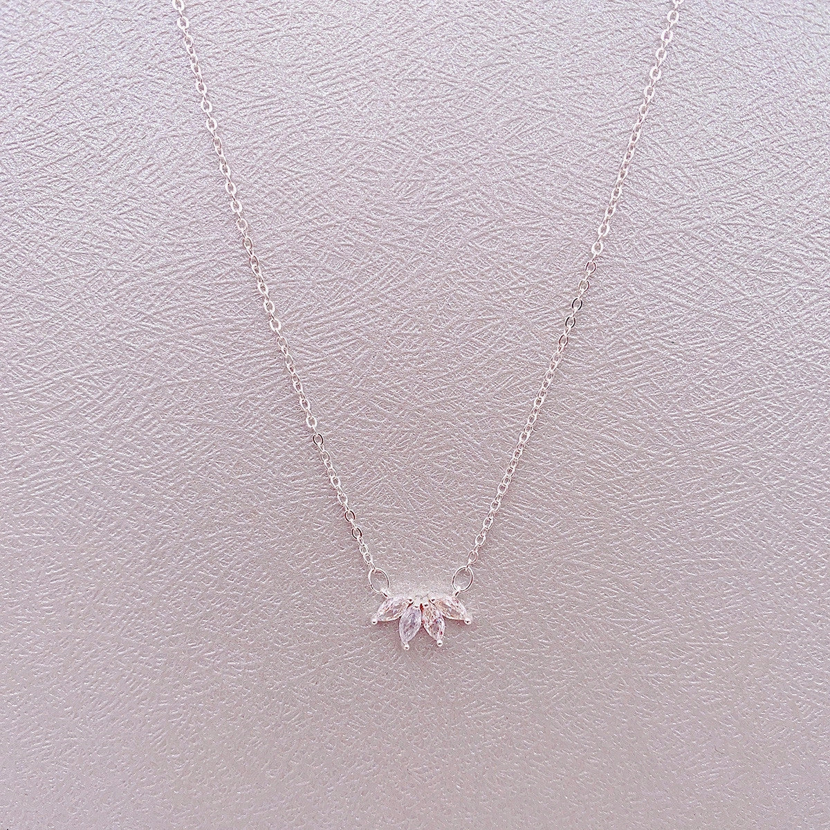 Minimalist lotus flower petal necklace in gold and silver, perfect for parties and everyday wear