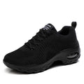 Red and black women's low top lace-up mesh sneakers with a round toe and mid heel.