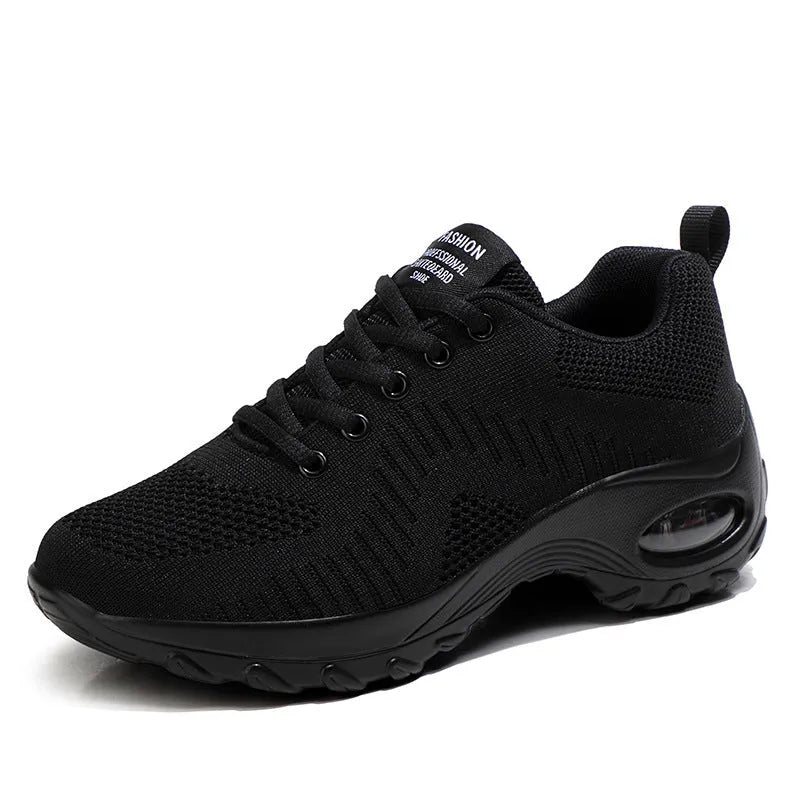 Red and black women's low top lace-up mesh sneakers with a round toe and mid heel.