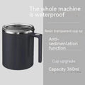 White automatic stirring coffee cup with magnetic base and stainless steel interior