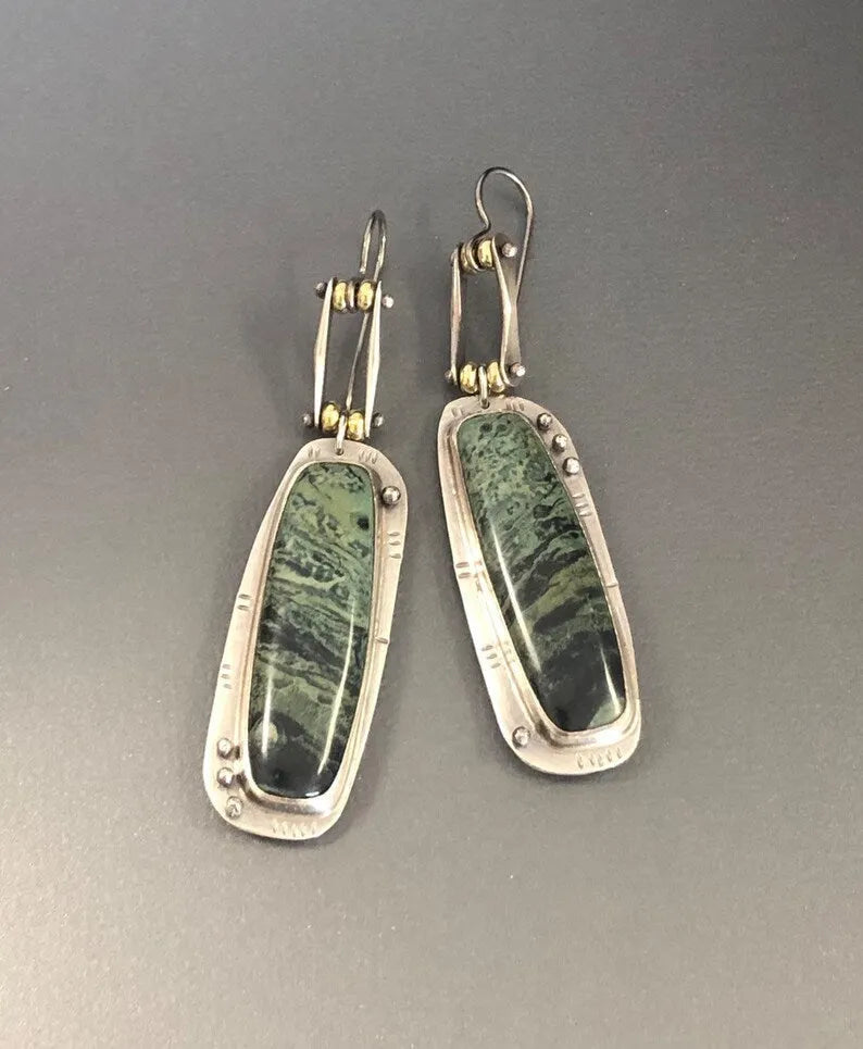 Geometric-shaped alloy earrings with a white and grey two-tone marble pattern.