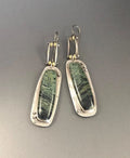 Geometric-shaped alloy earrings with a white and grey two-tone marble pattern.