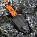 Straight survival knife with rope handle and black ABS sheath on a paper box.