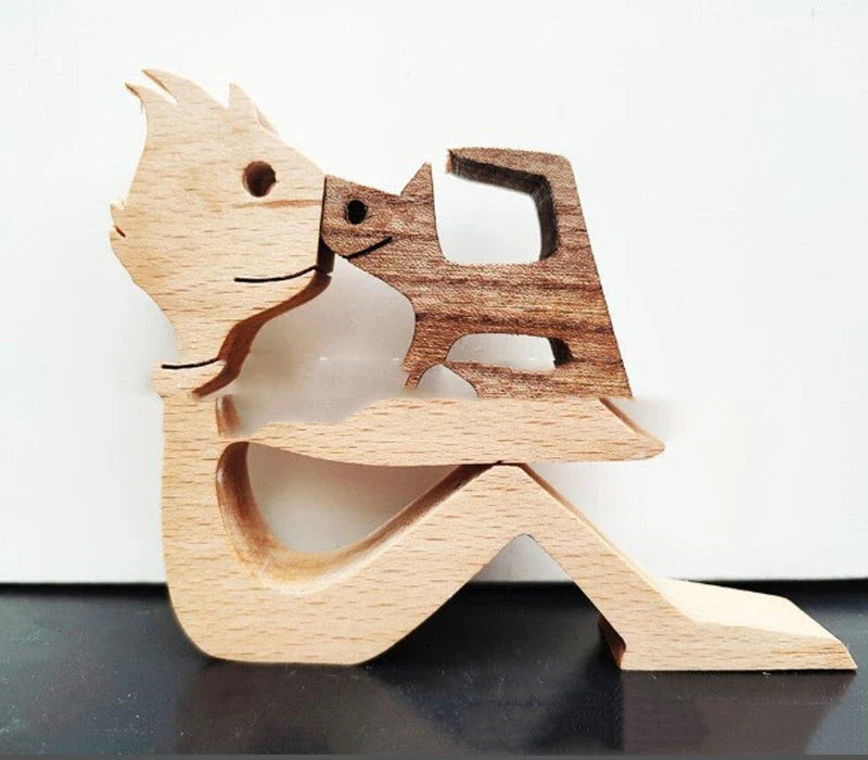 Handcrafted wooden dog sculpture featuring a man and his loyal canine companion