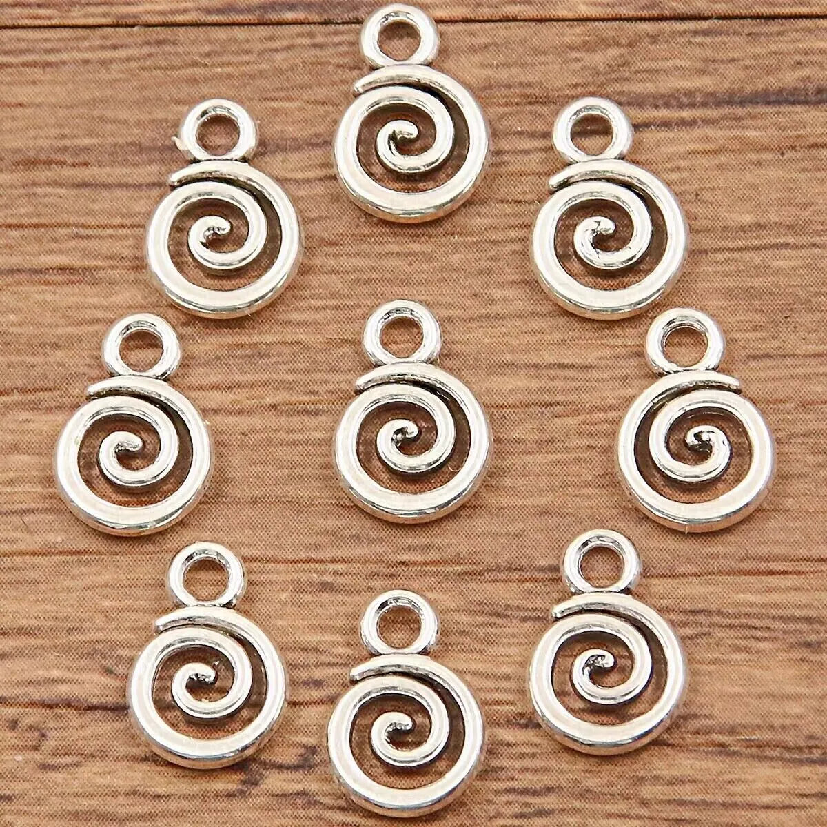 Double-sided hollow circle pendant in alloy with electroplated finish, simple round style, 7x11mm size on white background