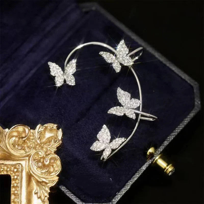 Stylish butterfly ear clips in gold and silver colors, featuring a delicate bow-tie design for fashionable women