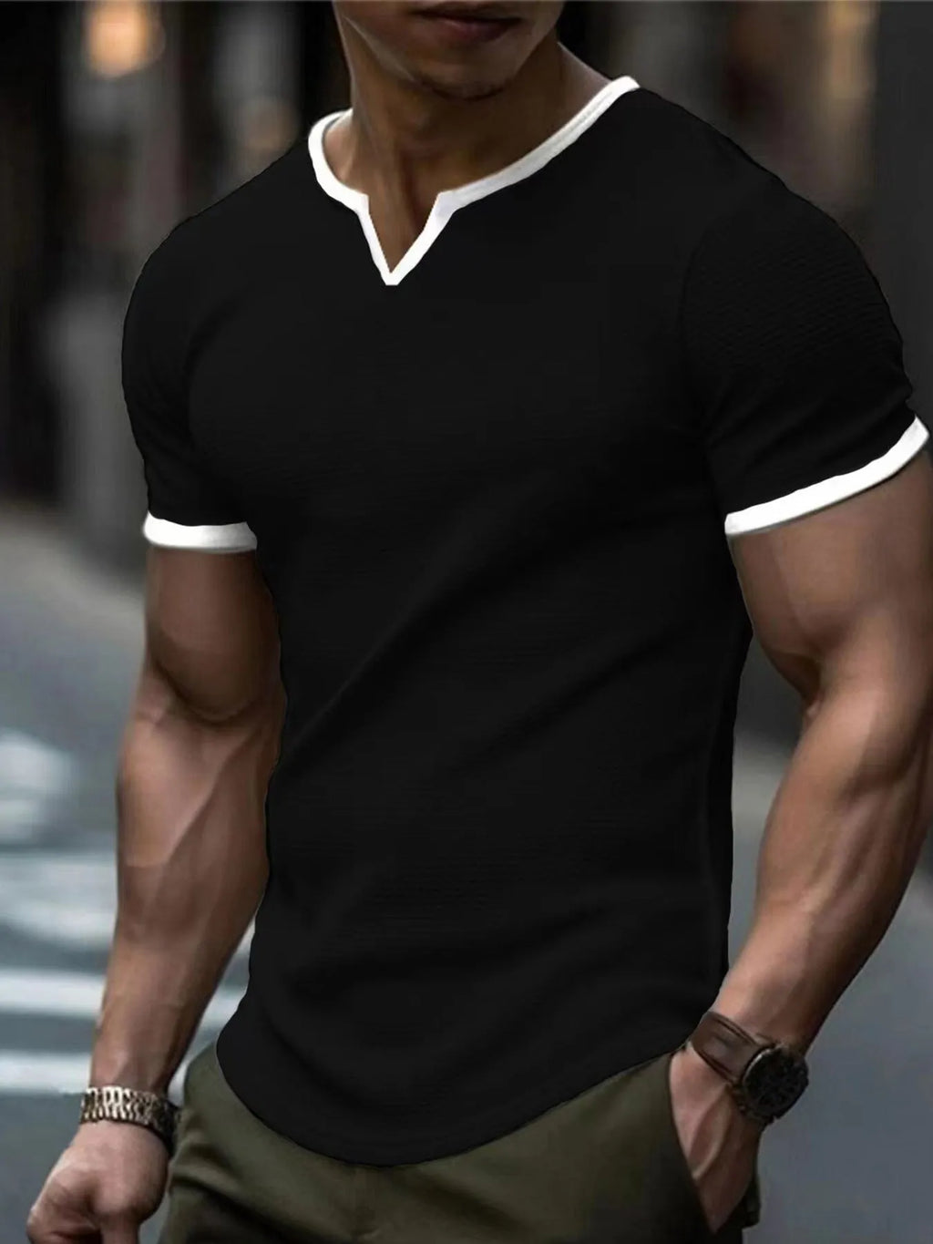 Colour-block V-neck sports t-shirt in waffle-knit polyester fabric on a hanger.