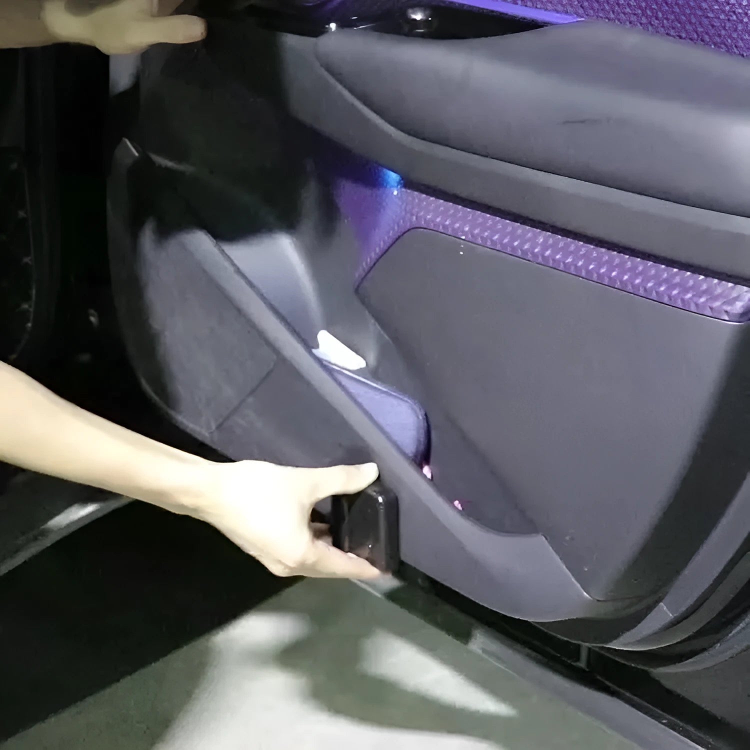A small, square black or beige ABS plastic car projection lamp for dashboard decoration.