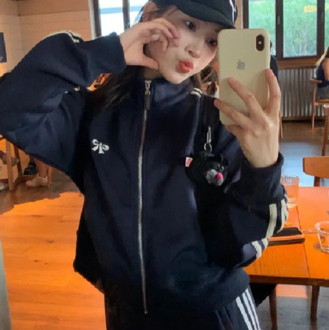 Women's retro baseball jacket in slim fit polyester with front pockets, available in navy blue or gray
