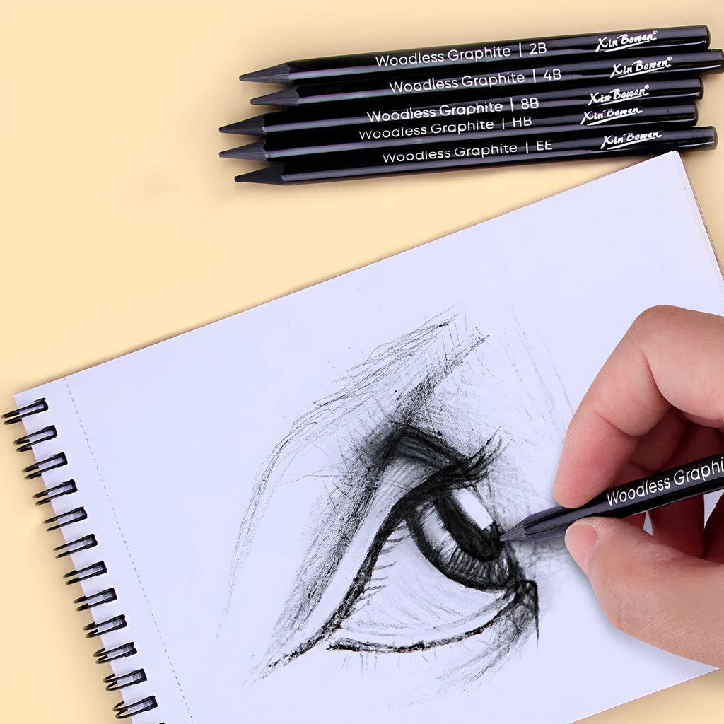 Set of six wood-free graphite art pencils with different grade markings: HB, 2B, 4B, 6B, 8B, and EE.