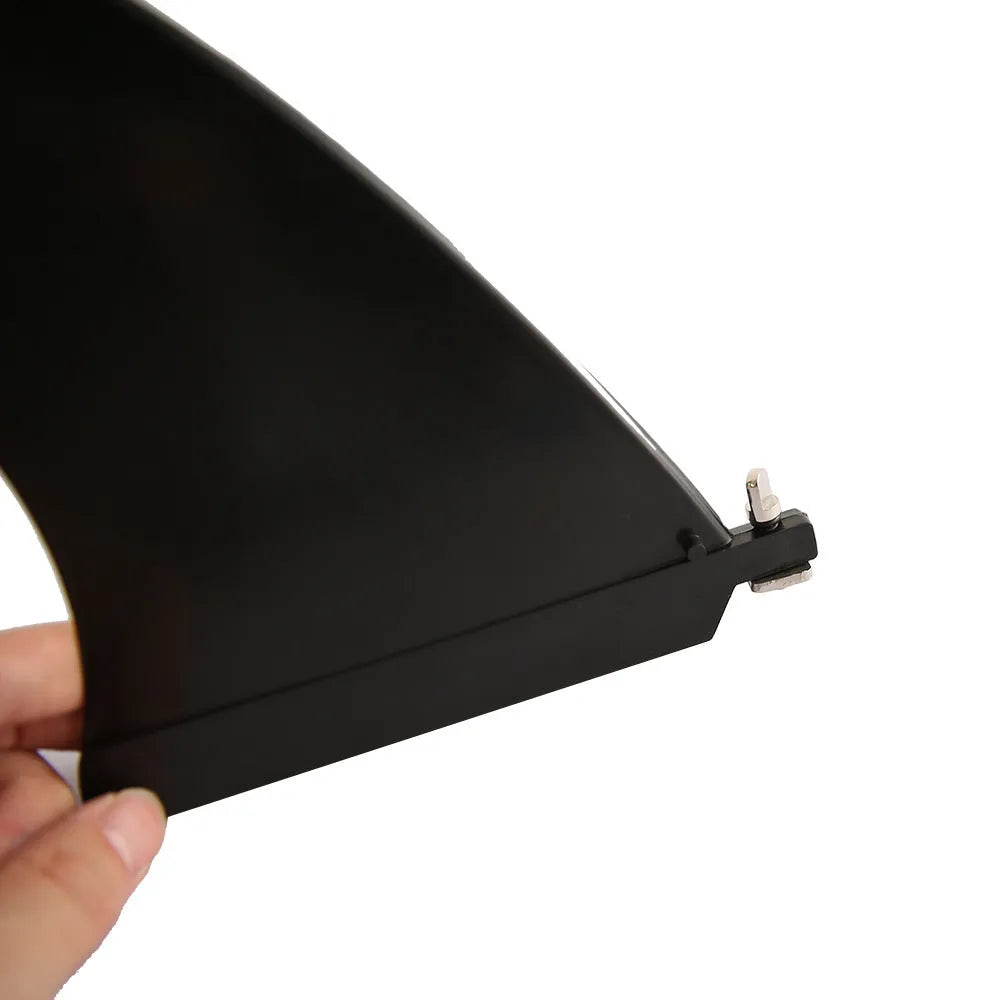 SUP paddle with large removable fish fins showing plastic construction and detachable components