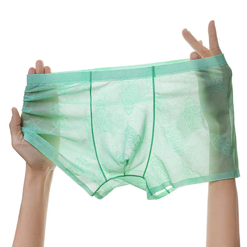 Men's ice silk seamless boxers in mint green – lightweight transparent nylon underwear with mid waist design on white background